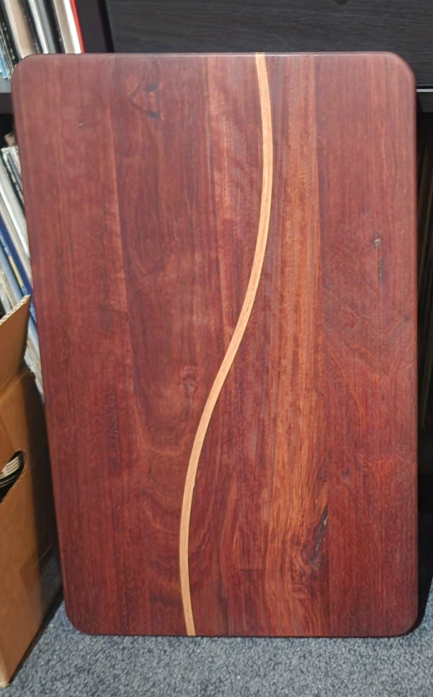The Meander mixed Australian hardwood board with its defining S-shaped timber line