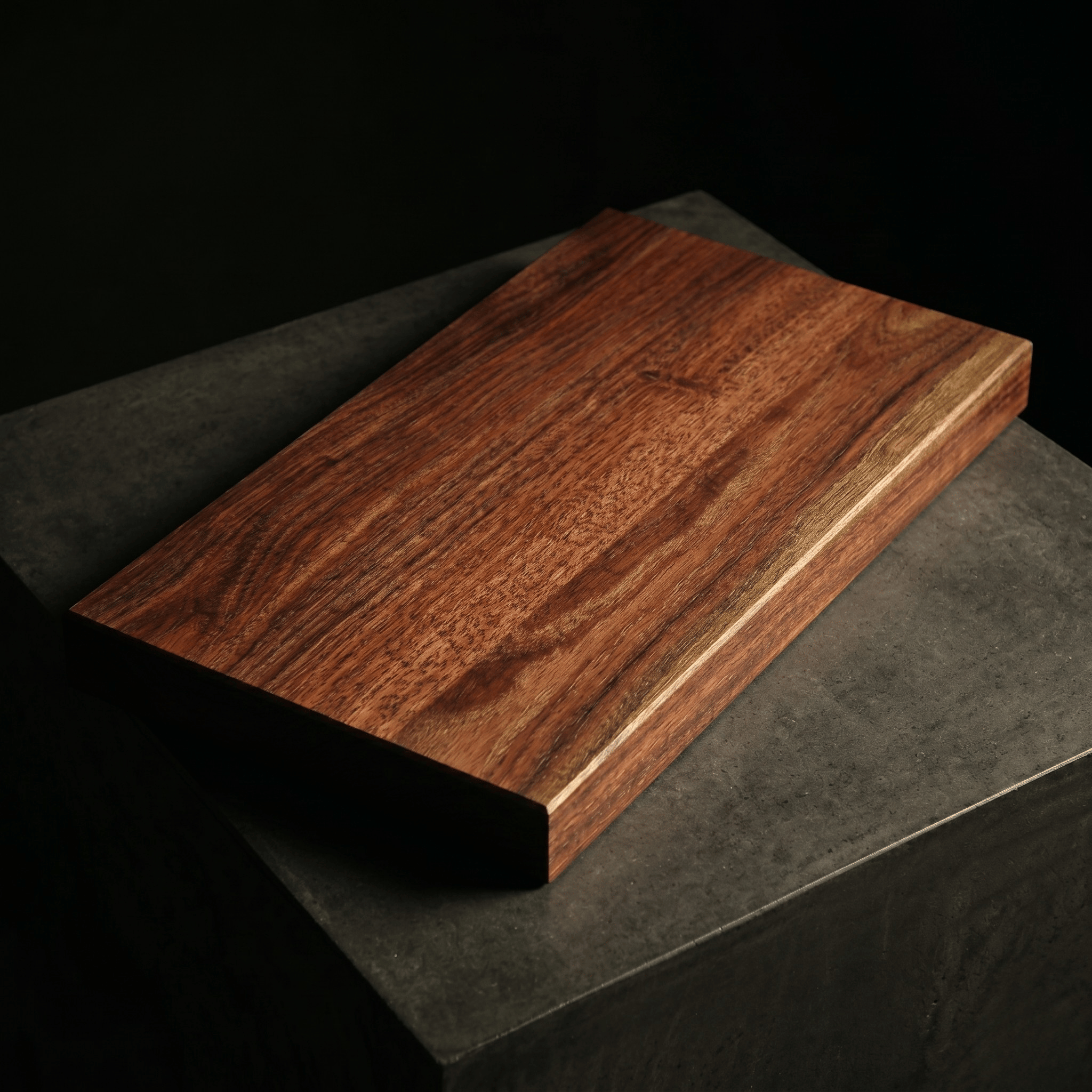 The Brook River Red Gum board on a stone plinth
