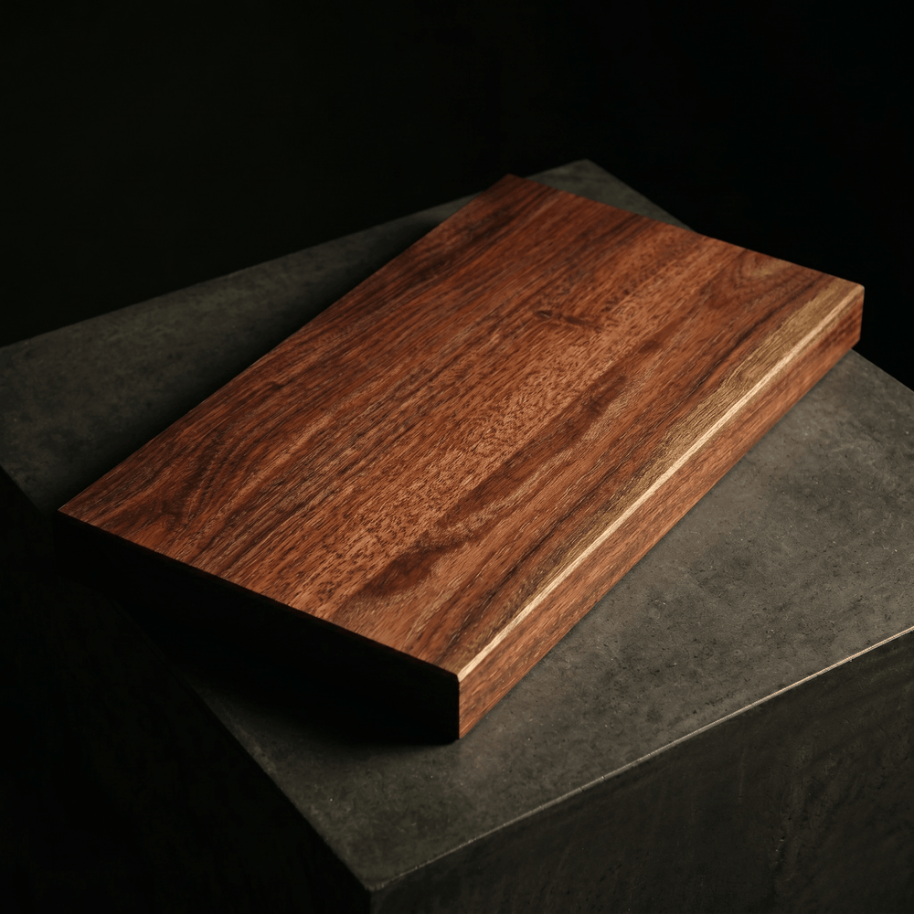 The Brook River Red Gum board on a stone plinth